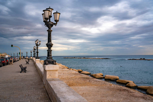 istock Bari seafront lights. Coastline and Twilight purple and blue sky. 1204988828