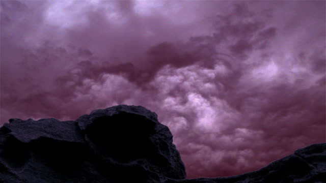 Timelapse of clouds and rock.