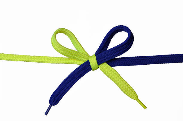 Yellow and Blue shoelace stock photo