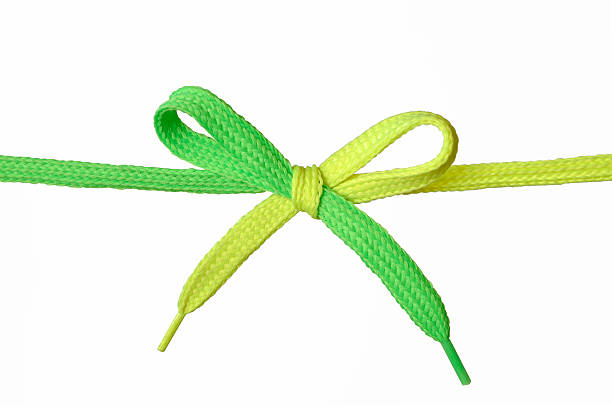 Green and Yellow shoelace stock photo
