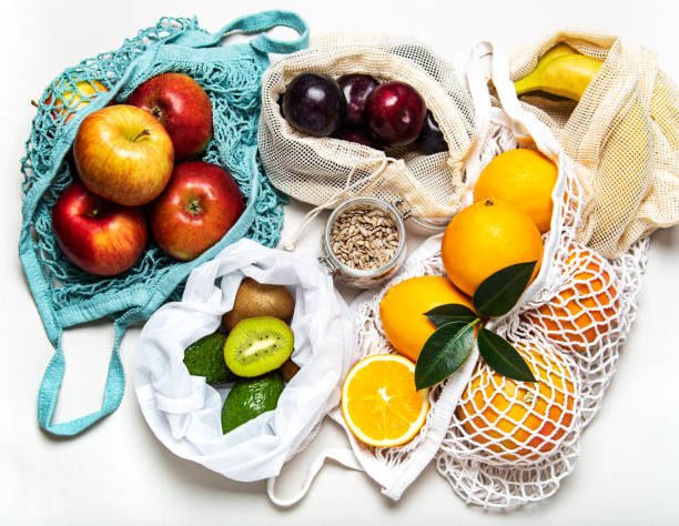 istock Mesh shopping bags with fruits 1204993270