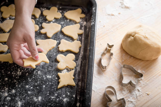istock Cutting cookies from dough with cutters 1204993380