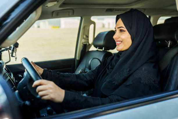 istock Arabic woman driving in a car 1204993474