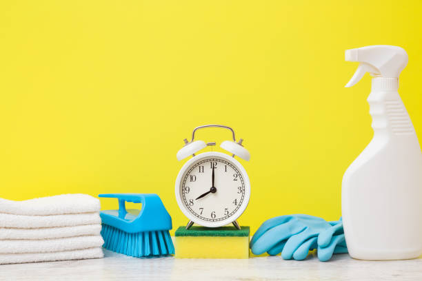 istock Cleaning set for different surfaces in kitchen, bathroom and other rooms. Bright yellow background. Time for spring cleanup. Front view. Closeup. Empty place for text or logo. 1204994498