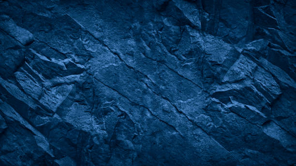 istock Dark blue grunge background. Blue stone background. Toned mountain texture close-up. 1204994757