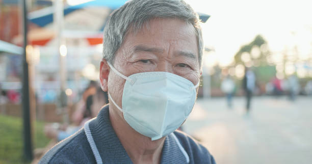 istock Asian elder man wears mask 1204995886