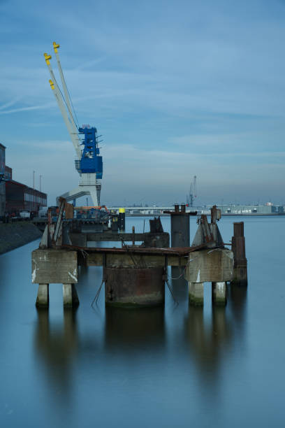 istock Old steel and concrete objects in the water 1204995894