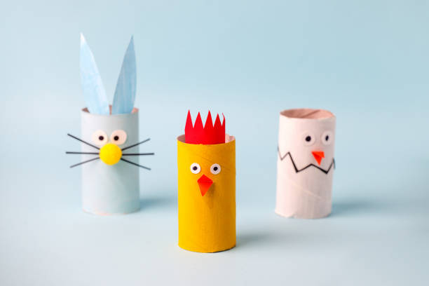 istock Happy easter spring toy collection on blue background for kids holiday party concept background. Paper crafts, DIY. creative idea from toilet roll. reuse, recycle handmade 1204998082