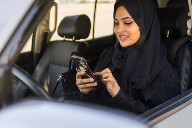 istock Arabic woman driving in a car 1204998140
