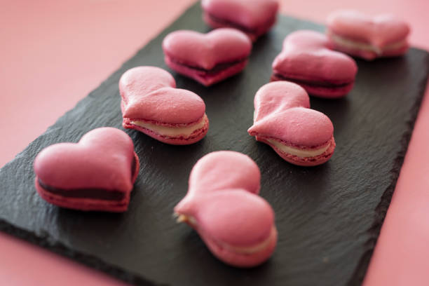 istock Pink macaroons in the heart shape 1205001909