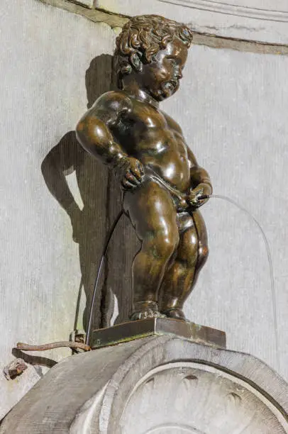 Pissing Boy statue (Manneken Pis) in Brussels Belgium - architecture background
