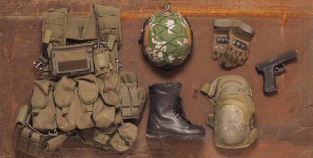 istock Concept - service, security, Armed Forces, Private military company, navy, mercenary. Weapons, helmet, cleats, body armor on a rustic background. 1205006668