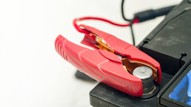 istock Recharging the car battery. Red copper clip attached to the plus terminal. 1205007385