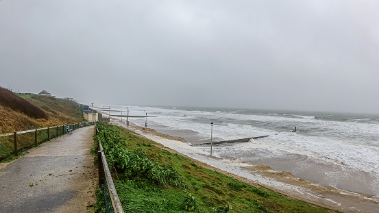 Bournemouth, Dorset / United Kingdom - February 9, 2020: Storm Ciara landing on Southwest English coast with huge crashing waves, very strong wind and rain