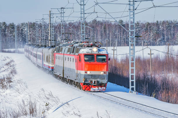istock Passenger train moves at winter morning time. 1205010402
