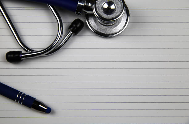 istock View on white index card with stethoscope and ball pen with copy space for text 1205011306