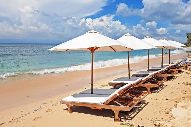 istock Beach umbrellas at Thomas beach on Bali Indonesia 1205012534