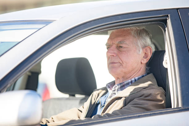 istock Active Senior Man Driving a Car - Stock Photo 1205015978