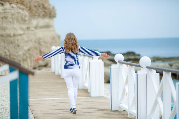 istock A woman jumps up for joy 1205016286