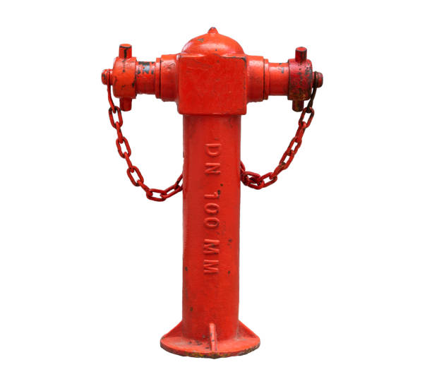 istock Vintage red street fire hydrant on a gray wall background. Isolated on a white background. 1205016541