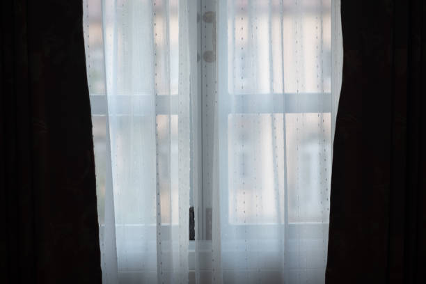 Transparent white curtain on window. Curtain background
