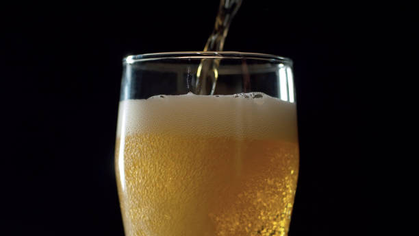 istock Beer pouring into the glass 1205019091
