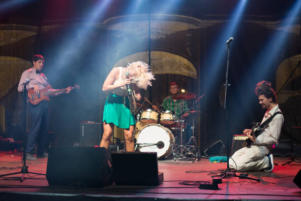 istock Rock group playing on the concert 1205023401