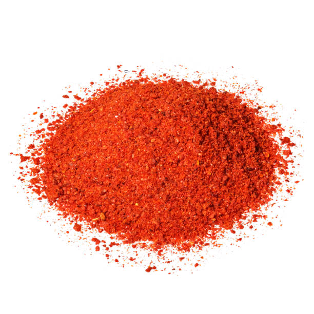 istock Powdered pimienta roja red pepper pile isolated on white. 1205023995