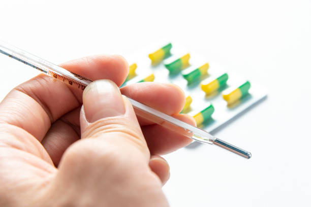 istock Thermometers and anti flu drugs 1205025249