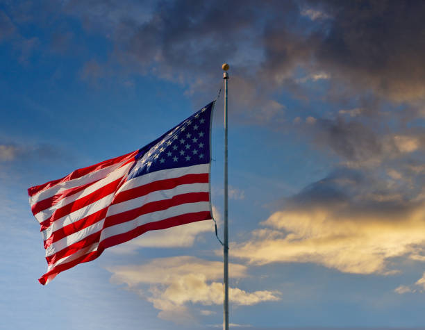 istock American Flag in Light Wind at Dusk 1205026842