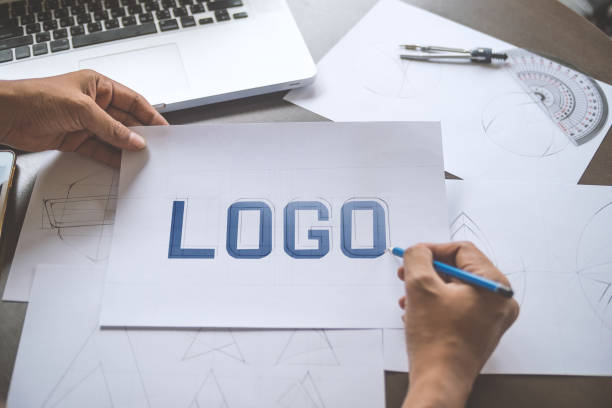 istock Graphic designer creative design sketch drawing logo Trademark brand Workspace 1205030199