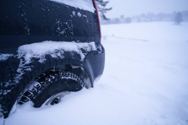 istock Under the snow. Car POV, driving on snow covered road, first snow falling. 1205032090