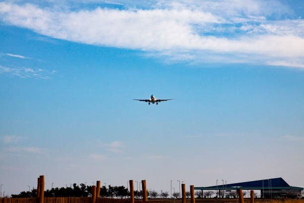 istock an airplane landing in the sky 1205034646