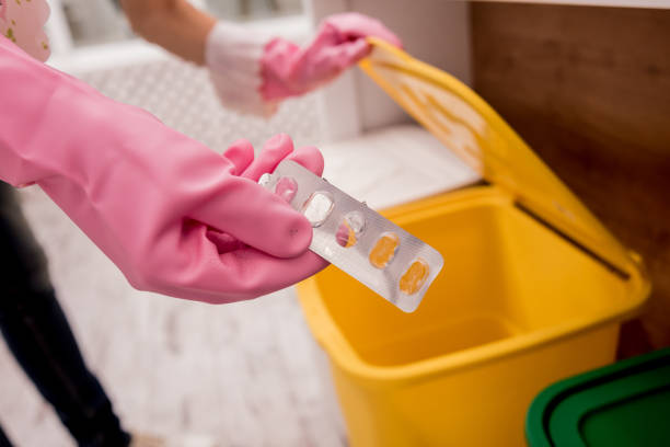 istock Young girl sorting garbage at the kitchen. Concept of recycling. Zero waste 1205036524