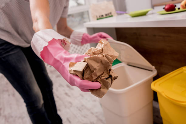 istock Young girl sorting garbage at the kitchen. Concept of recycling. Zero waste 1205036897