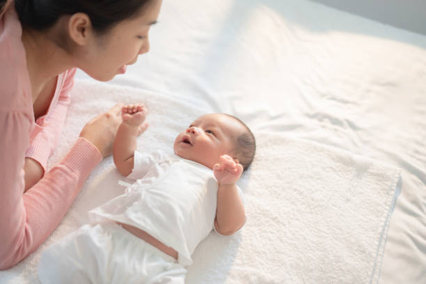 istock Newborn baby Talking to mom 1205039809