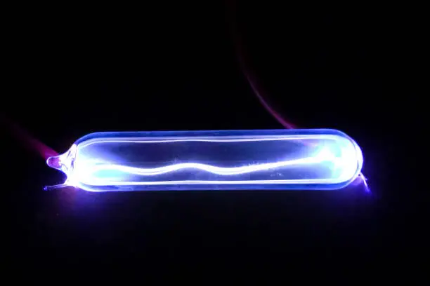 Electric arc in a flask with krypton. Gas discharge effect.