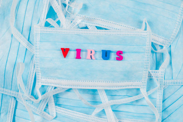 istock Colorful word virus on protective masks. 1205042492