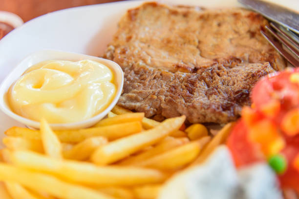 istock selective focus to Pork steak in dish 1205053741