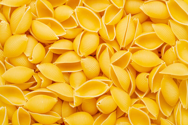 istock Pasta textured background for menu, website, postcard, decoration. Durum wheat traditional Italian raw pasta 1205053779