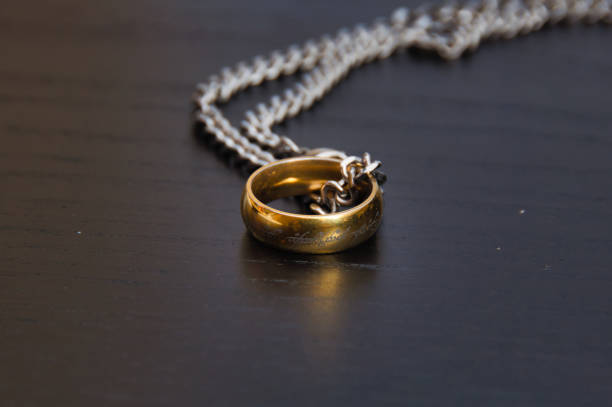 Jewelry maker, hands and gold rings showing creative work and craft of goldsmith in a workshop. Closeup of designer or jeweler in accessory manufacturing industry as art, job or hobby with gemstones