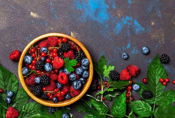 istock Summer berries in assortment, food background, top view copy space 1205056424