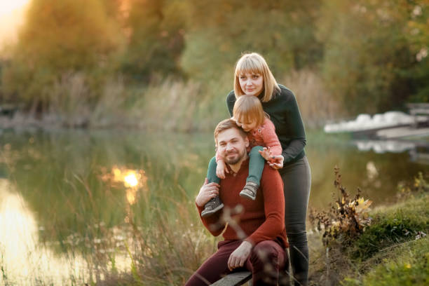 istock Family walks by the lake 1205057549