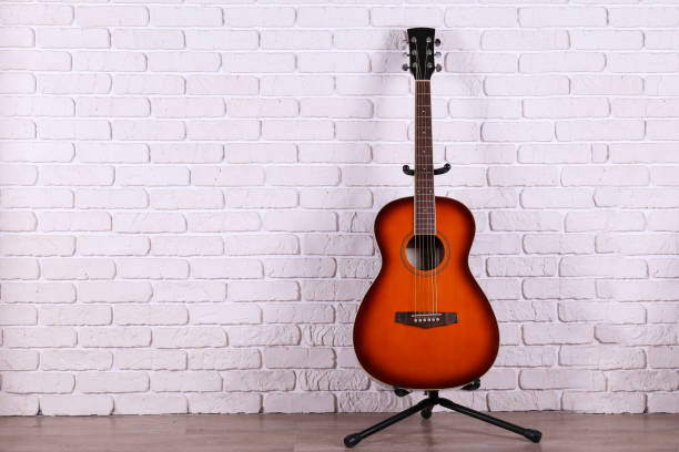 istock Smaller sized guitar with mahogany neck and a smooth rosewood fingerboard 1205057843