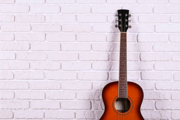 istock Smaller sized guitar with mahogany neck and a smooth rosewood fingerboard 1205058496