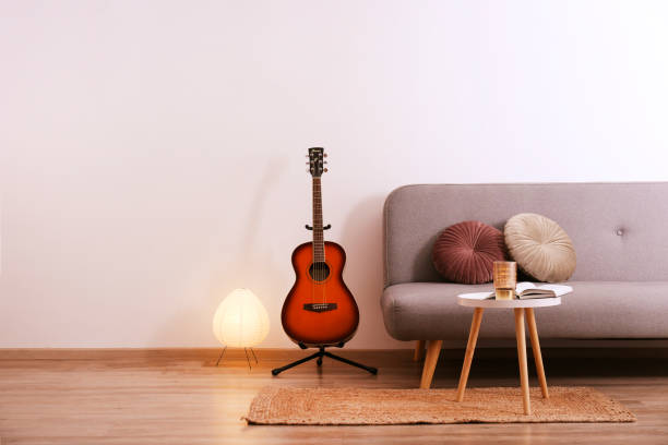 istock Smaller sized guitar with mahogany neck and a smooth rosewood fingerboard 1205058894