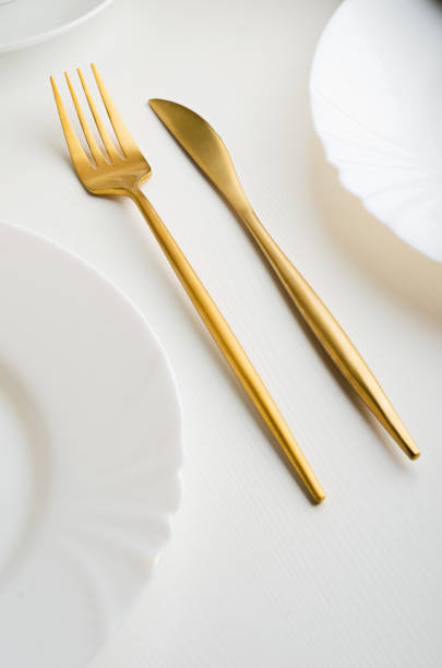 istock Modern trendy matte gold appliances - fork and knife 1205061180