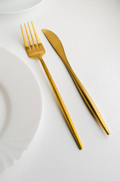 istock Modern trendy matte gold appliances - fork and knife 1205061189