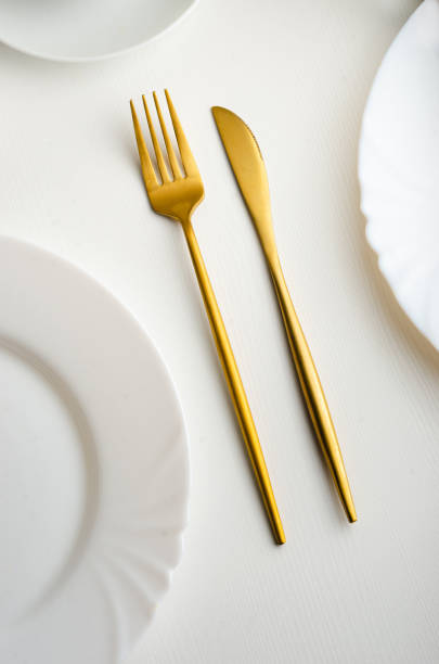 istock Modern trendy matte gold appliances - fork and knife 1205061204