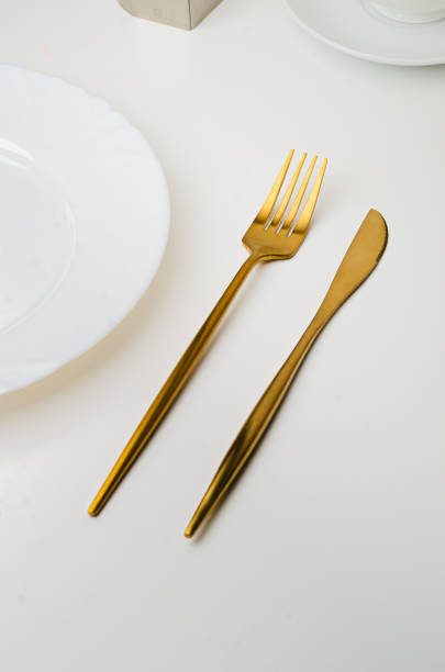 istock Modern trendy matte gold appliances - fork and knife 1205061216